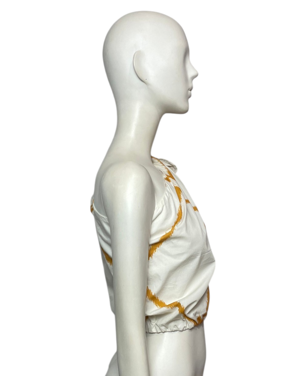 Blusa medio hombro amarillo y beige